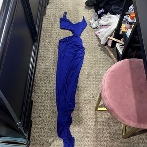Blue prom dress with a slit in the side opening to the stomach. Form fitting